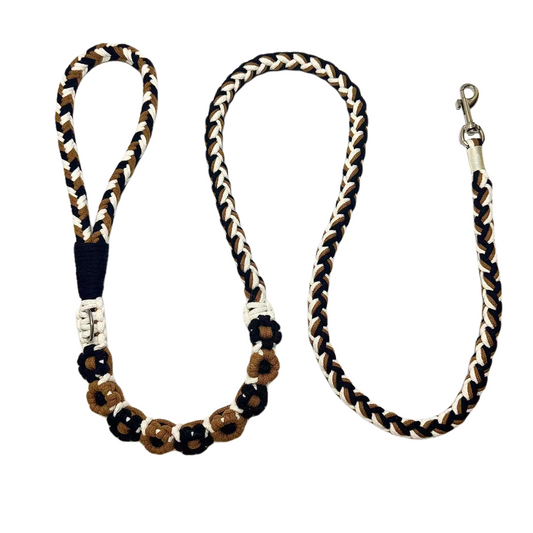 Black and brown nine-flower handmade dog leash laid flat, displaying its overall design with a calm and understated look.