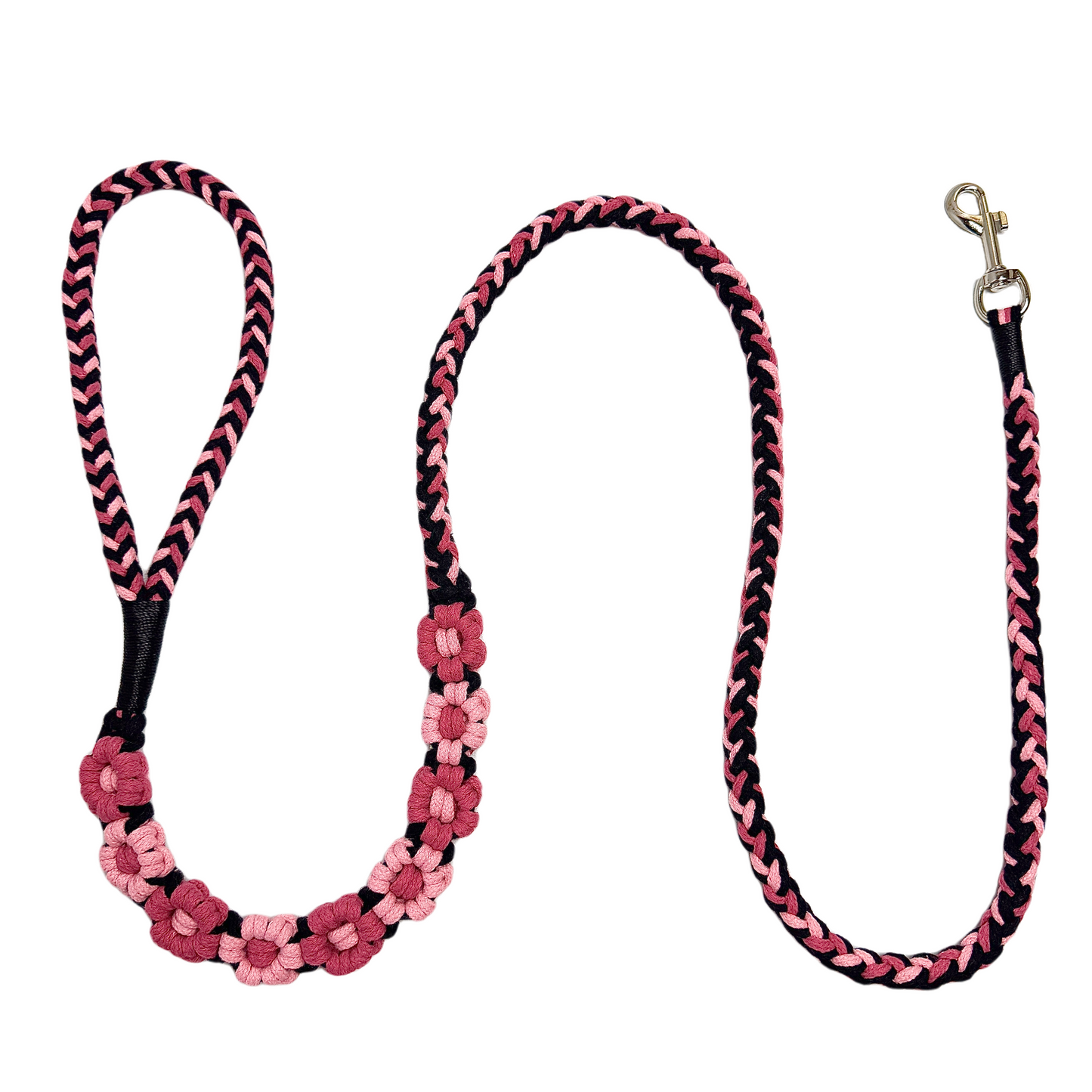 Black and pink nine-flower handmade dog leash laid flat, displaying its overall design with a attention-grabbing style.