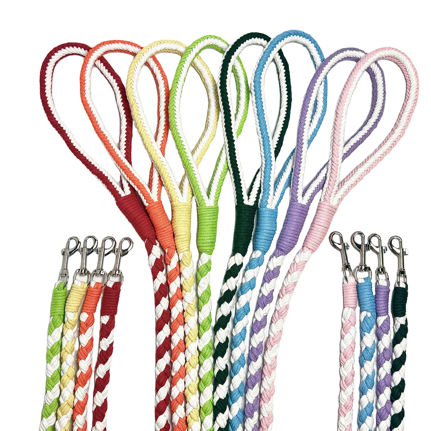 A collection of vibrant handwoven braided dog leashes in multiple colors, featuring durable cotton rope with sturdy metal clips. The leashes have looped handles for a comfortable grip and a stylish twisted design.