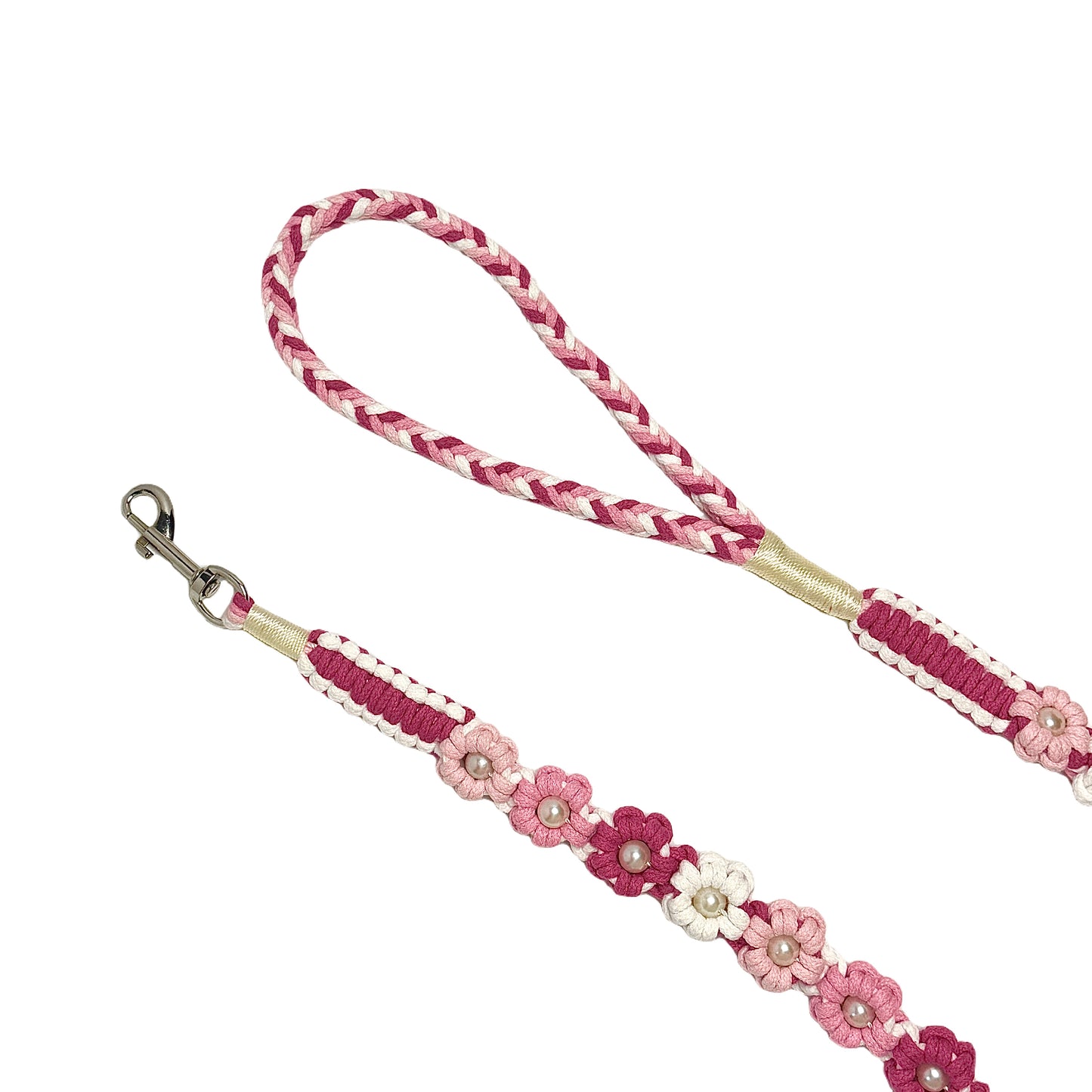 The soft handle and the clip of the handmade gradient pink dog leash, featuring multiple beautiful woven flowers.