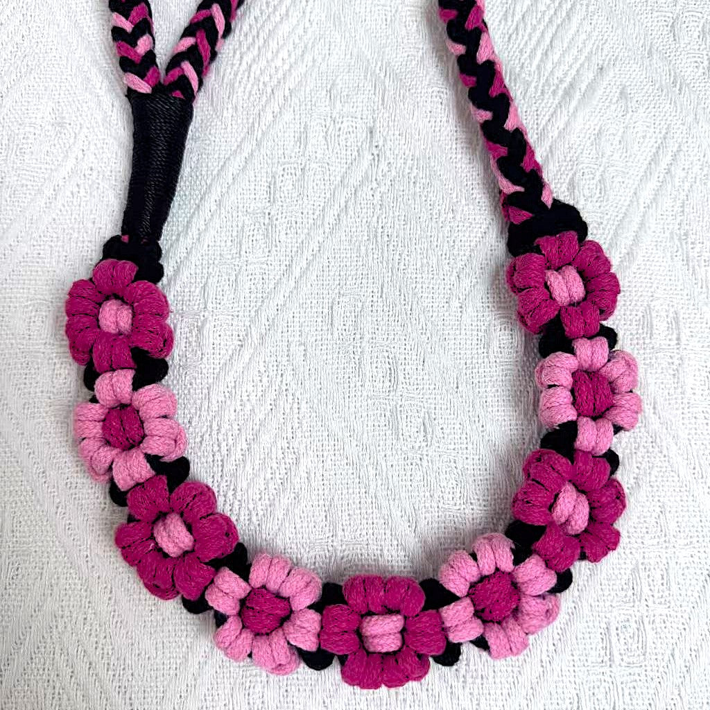 Handmade dog leash decorated with nine handcrafted flowers in gorgeous black and pink tones.