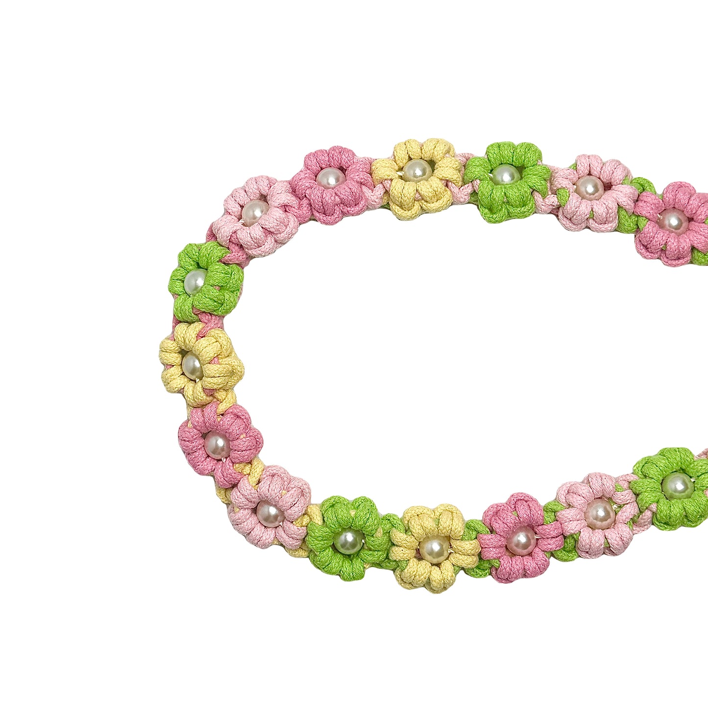 Dog leash decorated with numerous handcrafted flowers in bright yellow, green and pink tones.