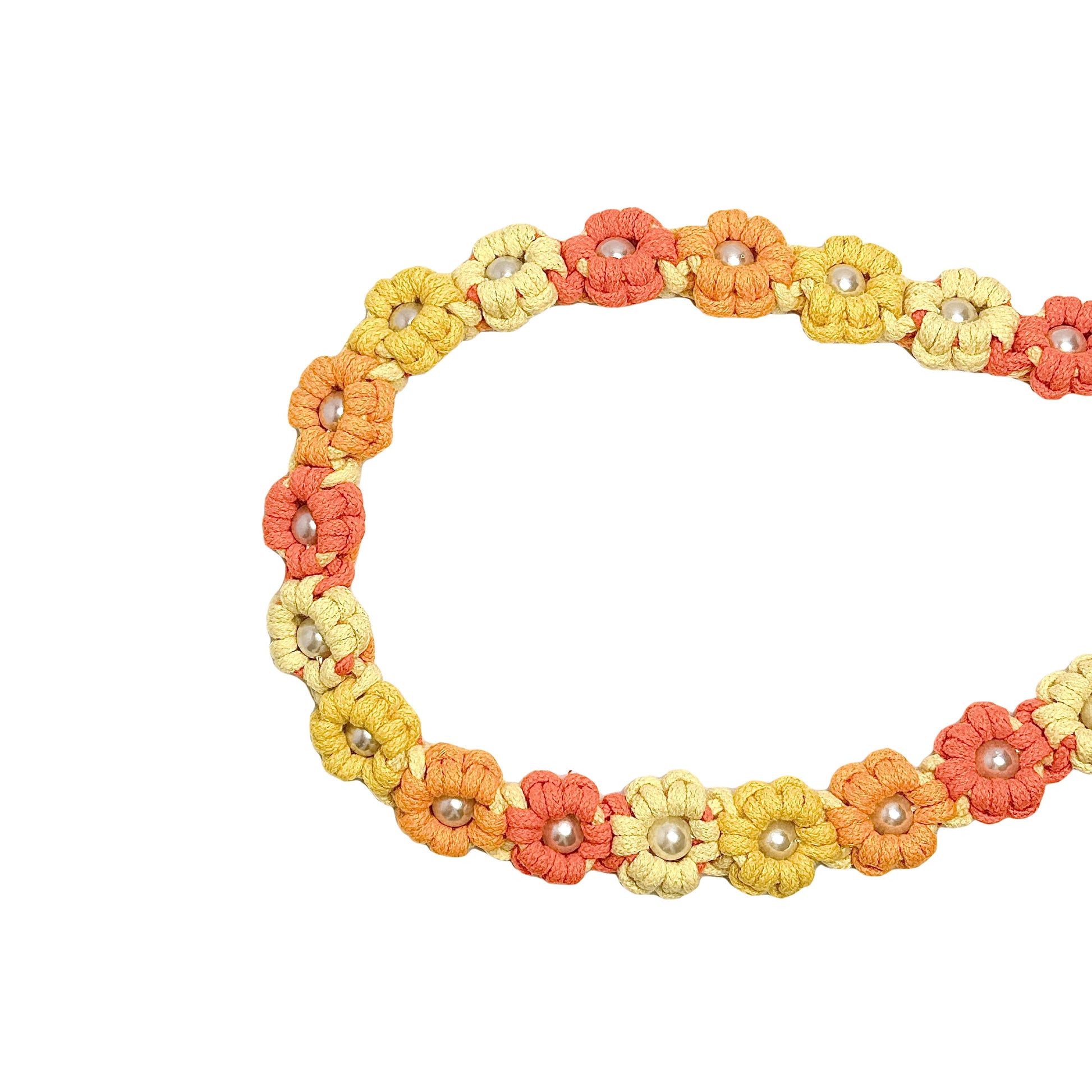 Dog leash decorated with numerous handcrafted flowers in vibrant orange and yellow tones.