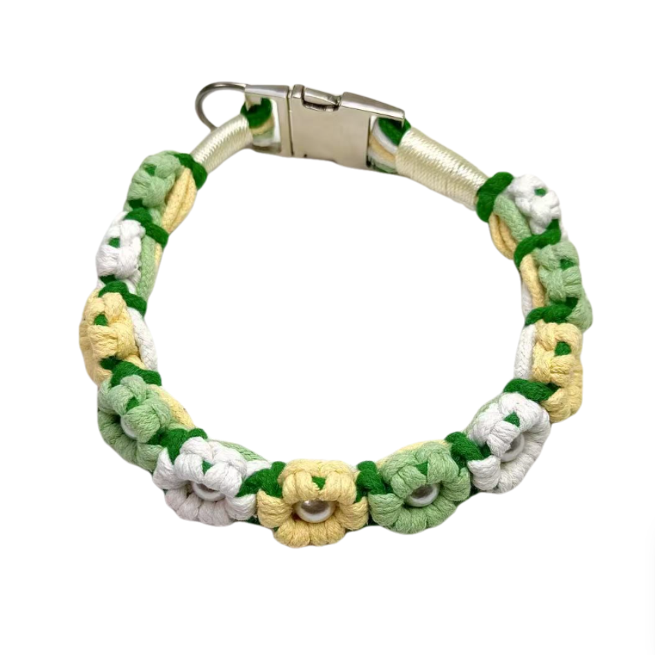 A green and yellow handmade dog collar featuring braided flower patterns with pearl embellishments, adding a touch of fresh to your pet's life.