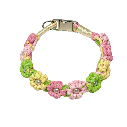 A green and yellow handmade dog collar featuring braided flower patterns with pearl embellishments, adding a touch of delight to your pet's life.