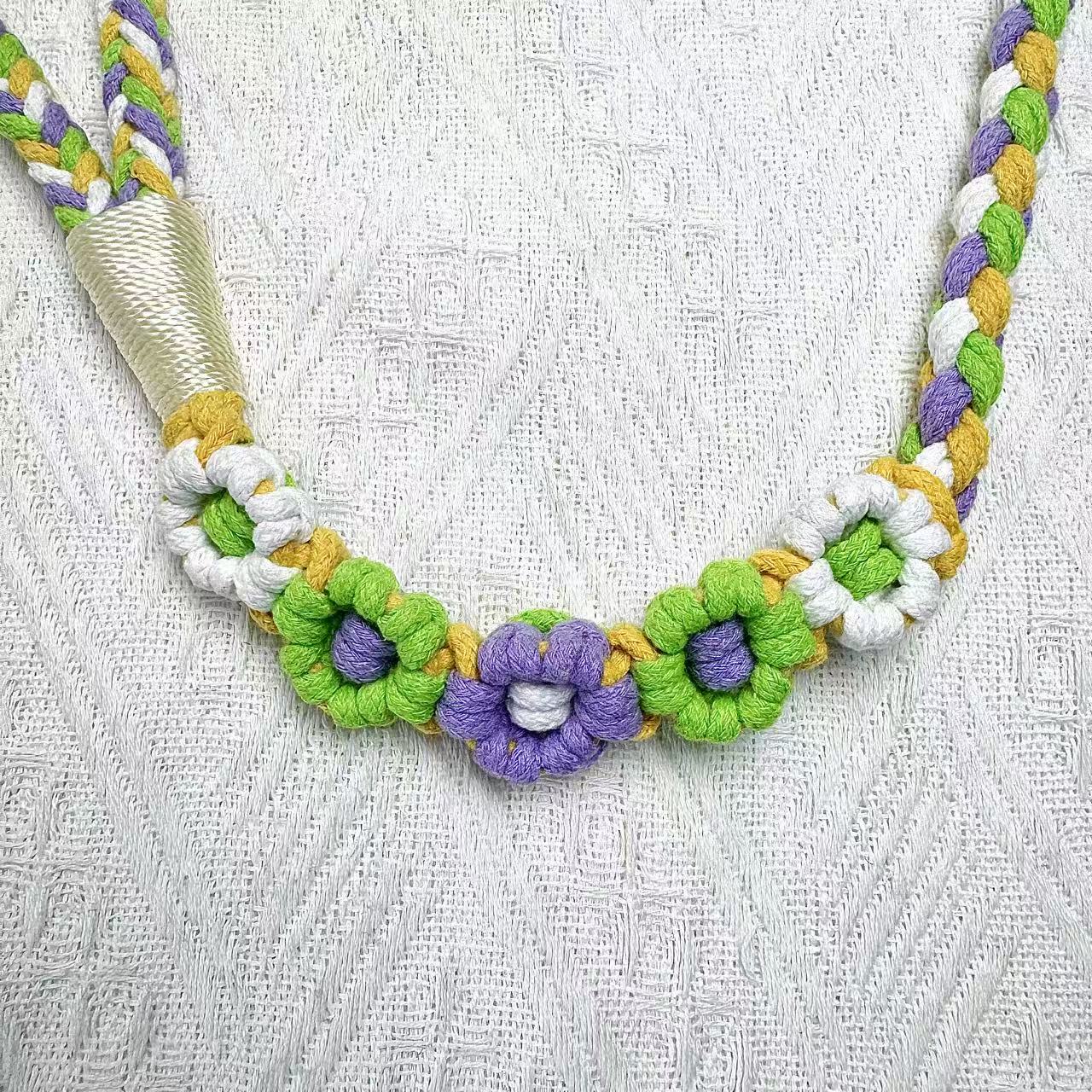 The handmade green yellow dog rope leash, detail of the five flowers.