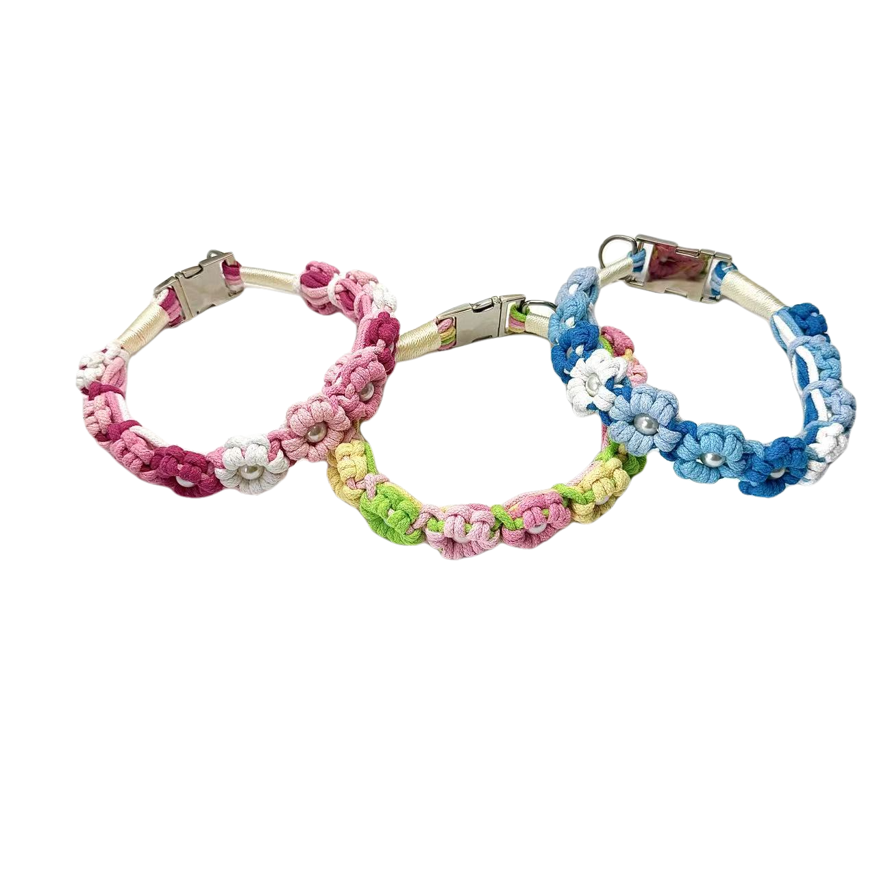 A set of three colorful handmade dog collars with braided flower patterns in pink, green, and blue, featuring metal clasps for secure fastening.