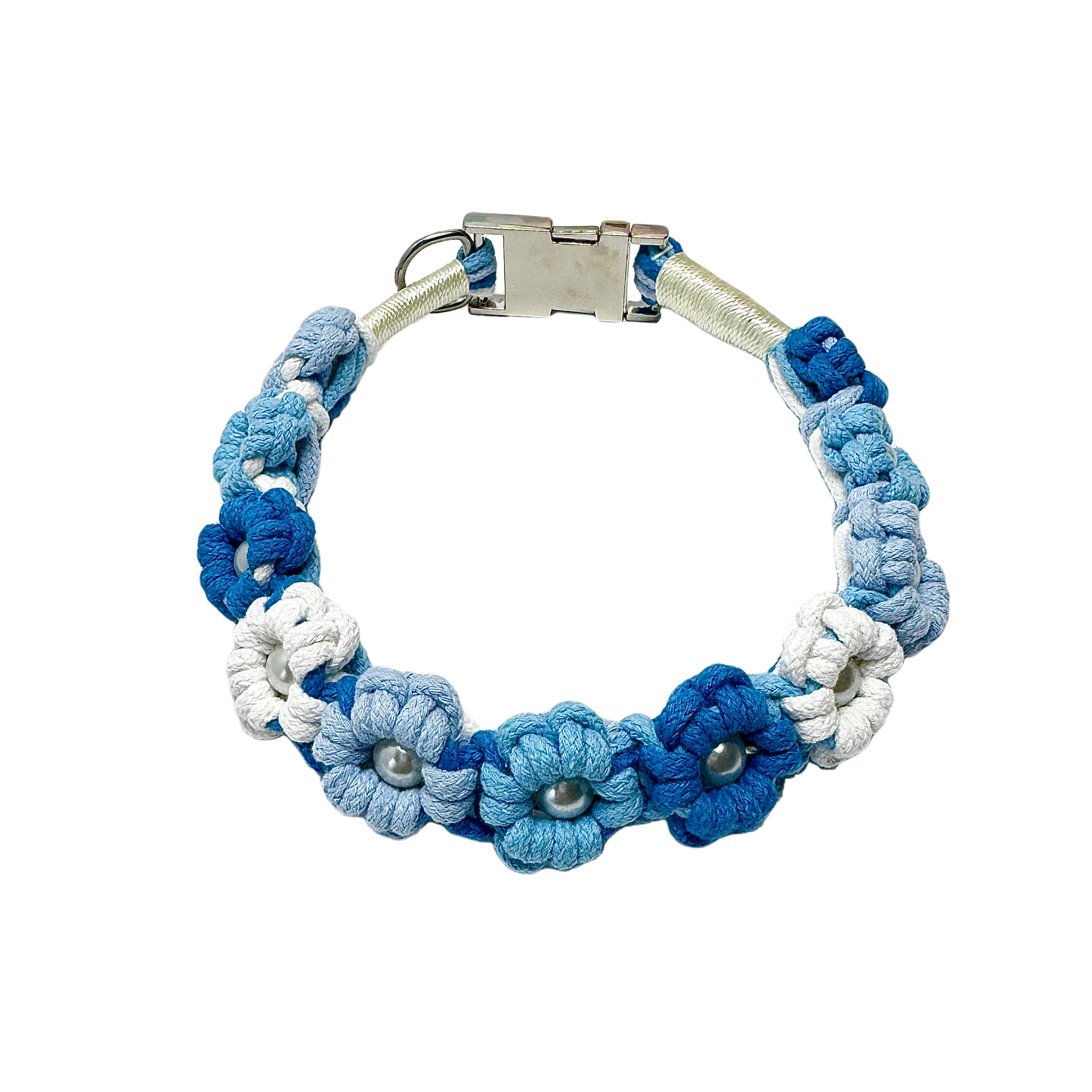 A blue and white handmade dog collar featuring braided flower patterns with pearl embellishments, adding a touch of serenity to your pet's life.