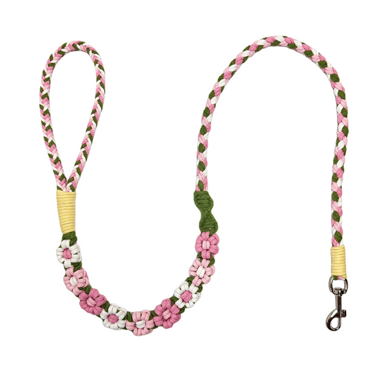 Pink and white nine-flower handmade dog leash laid flat, displaying its overall design with a spring and vibrant look.