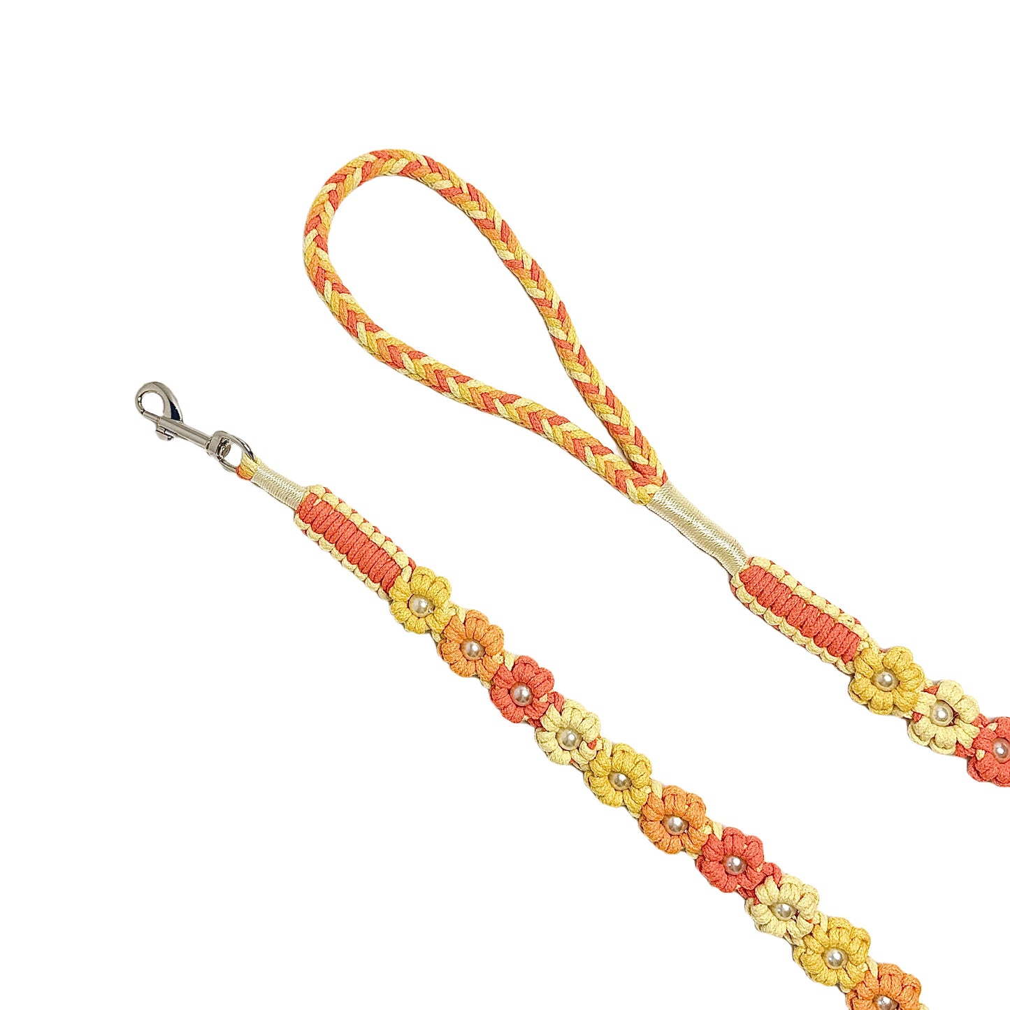 The soft handle and the clip of the handmade gradient yellow dog leash, featuring multiple beautiful woven flowers.