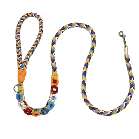 Red and blue nine-flower handmade dog leash laid flat, displaying its overall design with a vibrant and charming look.